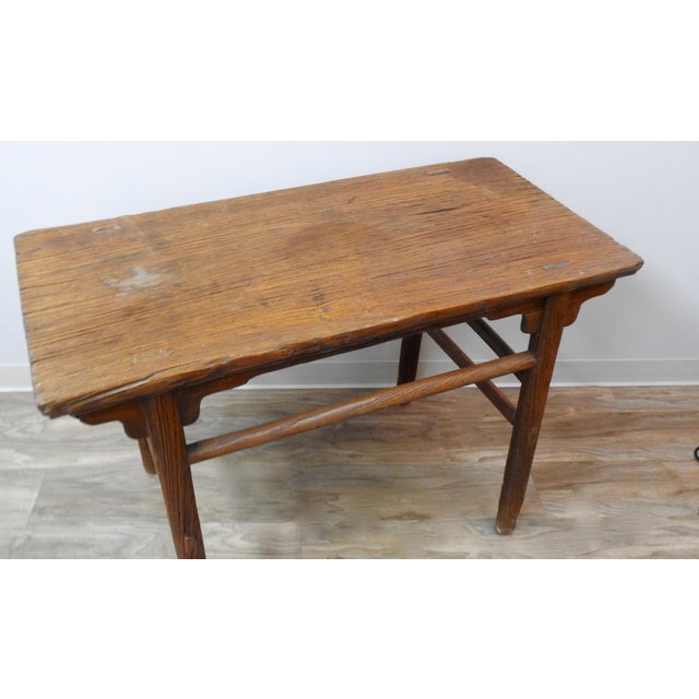 An exquisite, over 200 years old, altar table from the Shanxi province. This elmwood altar table has gorgeous natural...