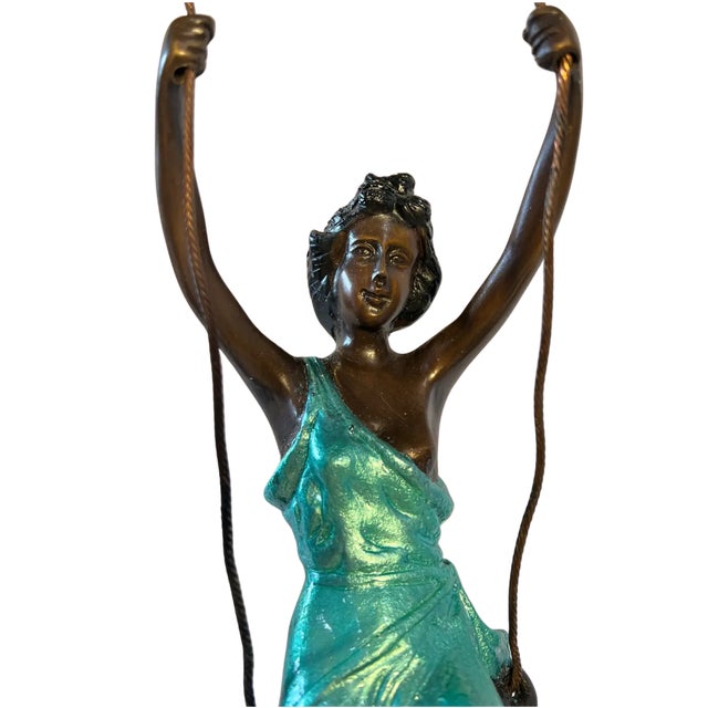 This enchanting bronze sculpture, inspired by Auguste Moreau’s iconic Girl on a Swing, captures the delicate beauty and...