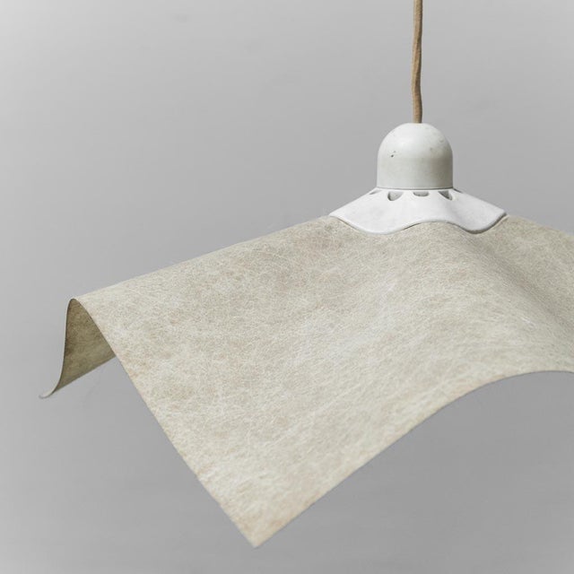 Area chandelier. Designed by Mario Bellini and produced by Artemide. Shade in durable parchment. 1970s design This piece...
