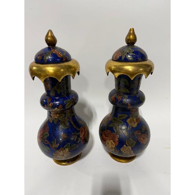 A decorative pair of 19th century English lidded vases in the Brighton Pavilion taste, turned in wood and finished with a...