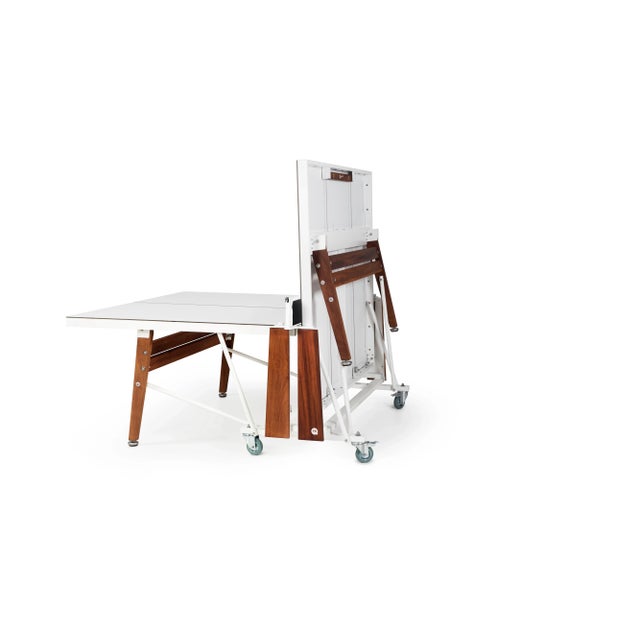 RS Folding Ping Pong table with white HPL top and iroko legs can be folded and stoREDwhen not in use and once opened is a...