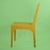 A fretwork desk chair newly lacquered in a cheerful mustard finish, with an open geometric back that keeps a desk or...