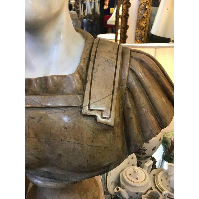 20th century marble roman bust of a roman military dignitary or emperor. Made with white and siena marble. H 24 in. X w 16...