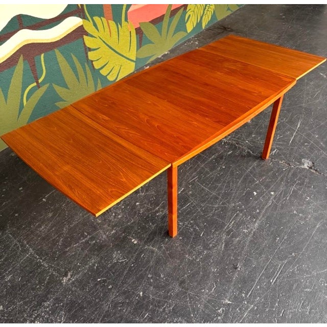 A classic, timeless Danish teak dining set with great size and proportions. Table possesses a drawleaf on either end to...