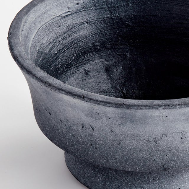 This roughhewn terracotta bowl really brings the drama. The handrubbed finish and intentionally rough surface add a touch...
