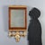 Finely crafted walnut mirror dating back to the early 19th century, from Italy. The frame features gilded moldings and...