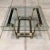 Vintage chrome and gold metal bent tubular form based coffee table with heavy glass top Romeo Rega style likely by design...