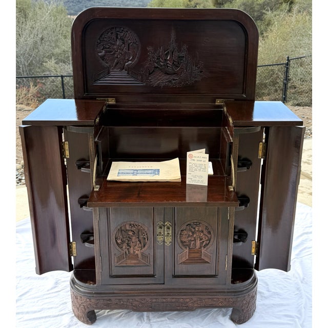 Mid-century Chinese hand-carved "altar style" cocktail dry bar cabinet, manufactured by H.K. Old Mary Sing Shun Company...