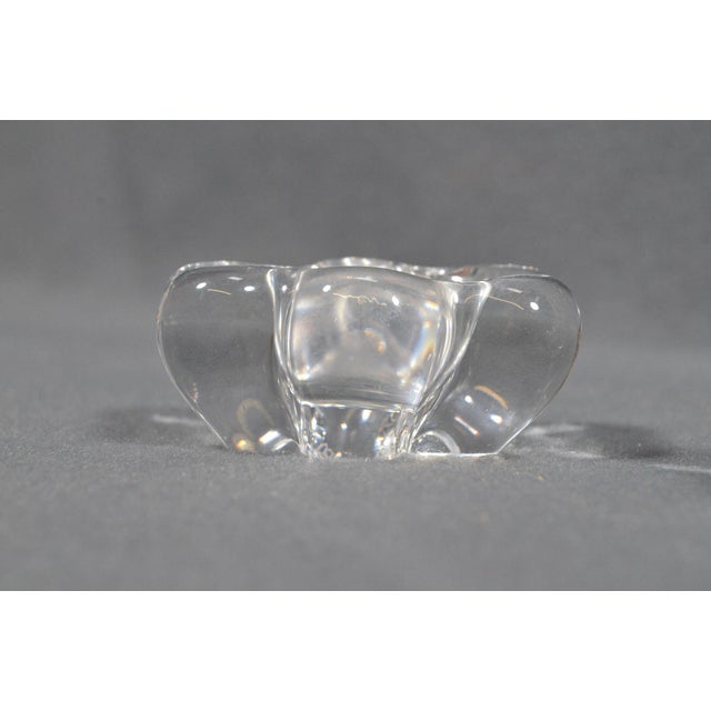 DAUM, France Pair of molded crystal salt cellars, with fluid petal-shaped design. A refined signed tableware set in clear...