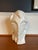 Sculptural ivory-colored bust by Harris Potteries, featuring an elongated face, almond-shaped eyes, and sweeping, stylized...