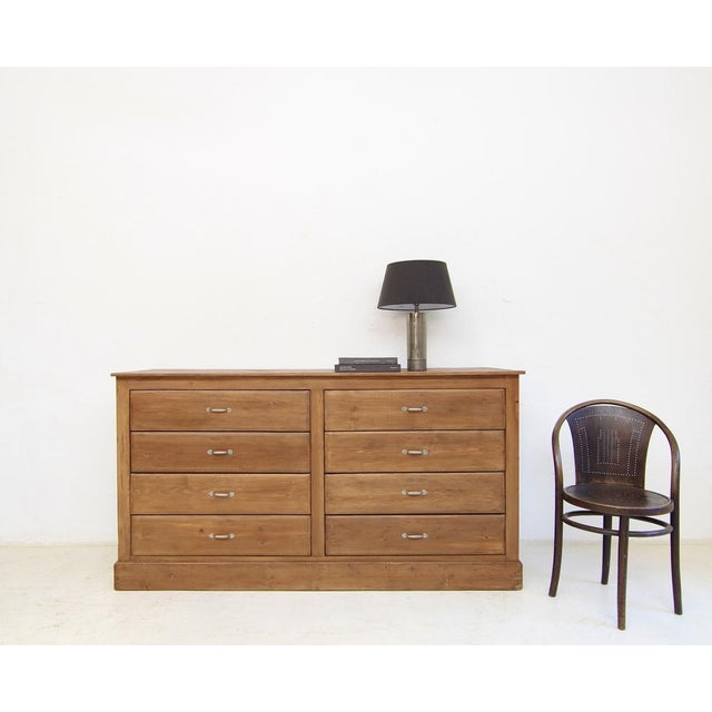 Vintage chest of drawers from an old shop fitting. First half of the 20th century. A rectangular, linear softwood cabinet...
