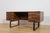 This freestanding desk was designed by Henning Jensen and Torben Valeur for the Danish furniture manufacturer Dyrlund...