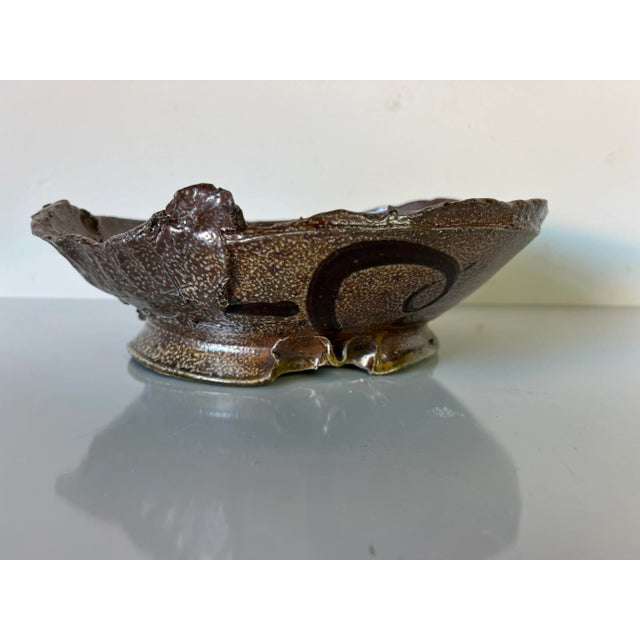 Mid Century Modern handcrafted studio art pottery abstract bowl sculpture. Features beautiful brown glaze finish with...