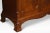 Mahogany three-door wardrobe, the moulded scrolling cornice above three long well figured panelled mahogany doors, opening...