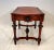 Multi-purpose victorian walnut table with leather inset. The top surface has straight sides and rounded ends. There are...