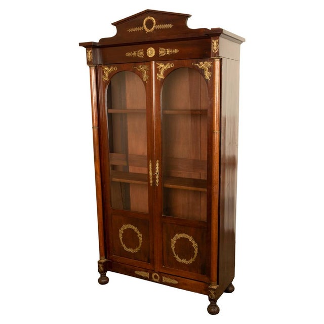 A fine antique French Empire Mahogany &amp; ormolu mounted bookcase display cabinet, circa 1910. This elegant antique...