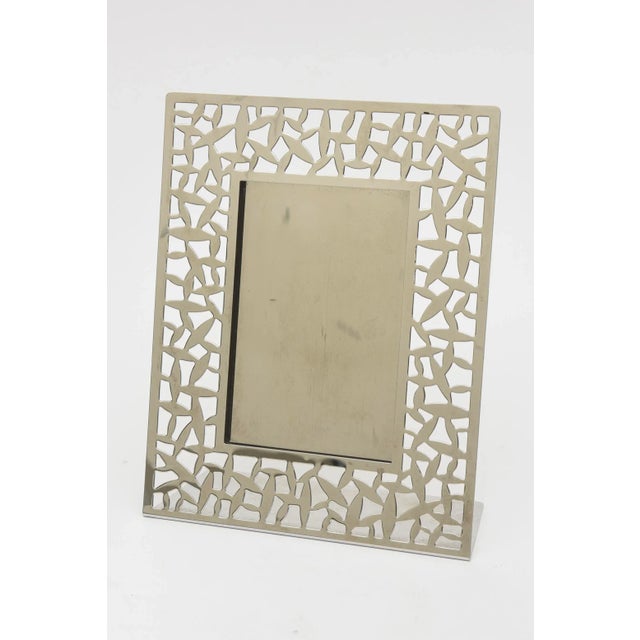 This fabulous vintage Italian stainless steel picture frame is by the Alessi Company and is signed on the back. The...