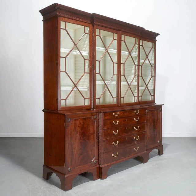Fine George III Mahogany Breakfront Bookcase. Last quarter 18th c., in six parts, with dentil molded and blind-fretted...