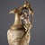Porcelain amphora vase with polychrome and gold floral and Greek key decoration. A mermaid sculpture adorns the handle....