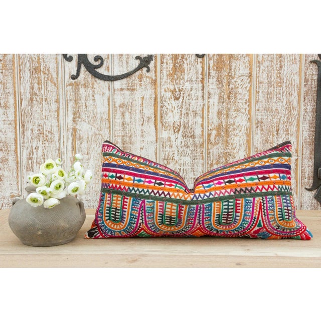 These colorful throw pillows are made from Rabari tribal dowry bags. The embroidery is on cotton and has intricate chain...