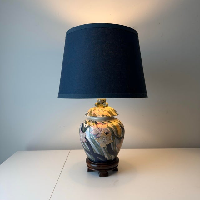 Vintage studio art pottery hand painted table lamp with violet florals and greenery.