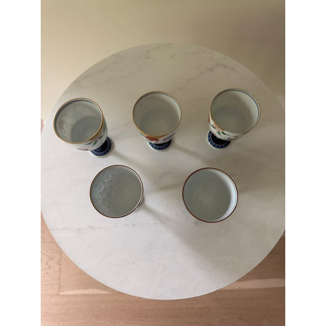 Teal Mid 20th Century Set of 5 Japanese Porcelain Footed Sake Goblets — Hand-Painted, Arita Style — Autumn, Garden & Egyptian Motifs For Sale - Image 8 of 8