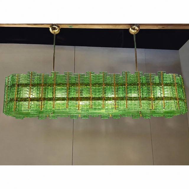 Contemporary gold chandelier in Murano Glass full of leafes that give a touch of "tropical" design. Extremally elegant and...