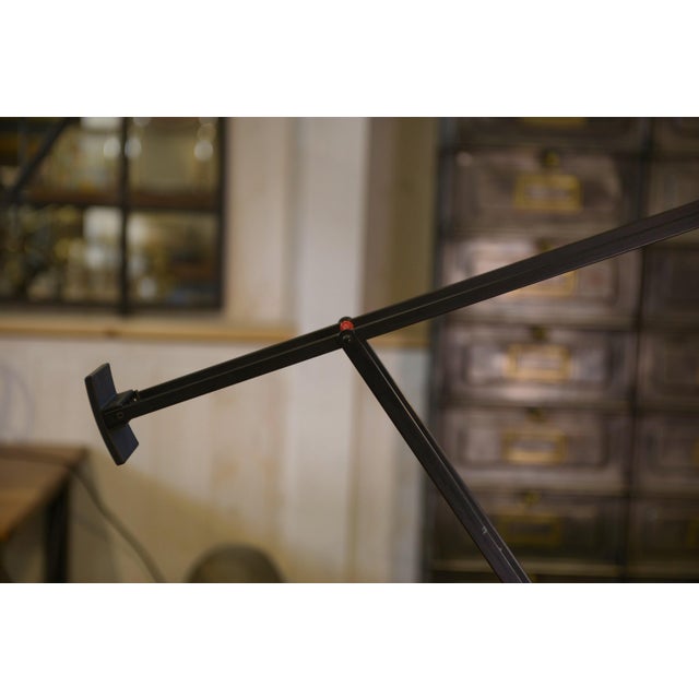 The Tizio desk lamp by Artemide, an icon of Italian design, is recognizable by its striking, graphic articulated arm. Its...