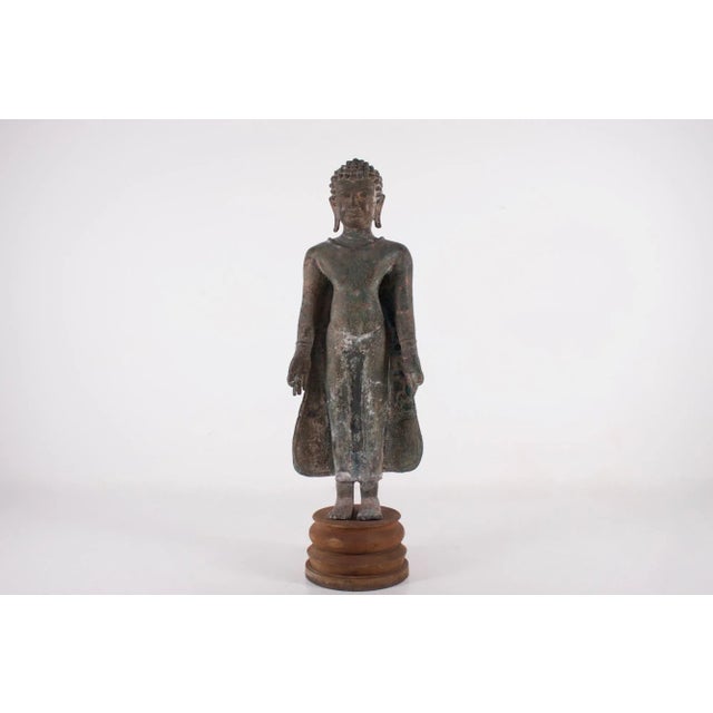 Large bronze buddha in the mon dvaravati style, both hands in jnama mudra, 19th century or earlier. good overall condition...