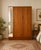 A freestanding double door teak wardrobe from Austinsuite Made during the 1960s Fitted out with clothes rail The style of...