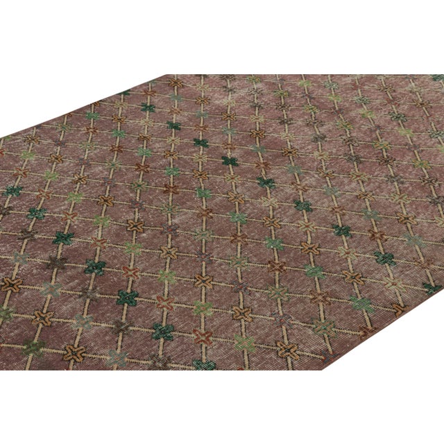 This vintage runner rug is a 5x10 Turkish distressed piece, made with hand-knotted wool circa mid-20th century. It is an...