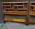 A handsome matched pair of vintage twin headboards by Baker Furniture, featuring bold geometric fretwork inspired by...
