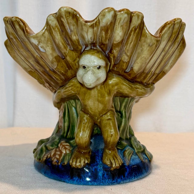 At Turtle & Crane, we turn the past into stunning décor for today. Two glazed monkeys crouch back to back on a cobalt blue...