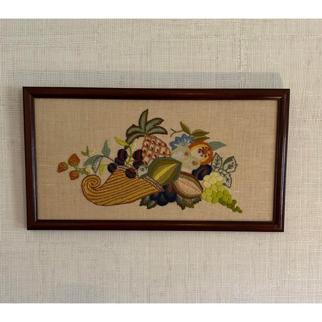 Vintage, Hand-made Cornucopia Crewel Artwork on beige linen with wood frame. H: 11.25" W: 20.75" We know it’s hard to find...