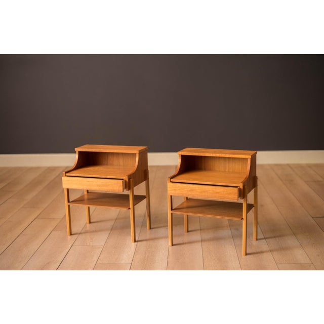 Mid century modern pair of bedside table nightstands in teak by AB Carlström & Co. Möbelfabrik, Sweden circa 1960's. This...