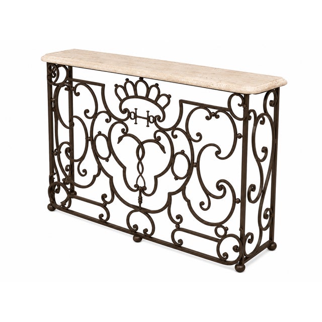 A French 19th century Louis XV style wrought iron and marble freestanding console. The console has a central reserve of...