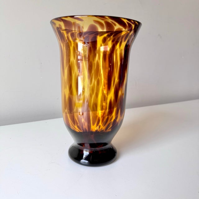Vintage blown tortoiseshell glass vase with a flared top. This wider set piece is excellent as a centerpiece! The lighter...