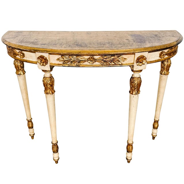 An elegant vintage Italian demilune console table in a Neoclassical style with a classic half-moon silhouette, perfect for...