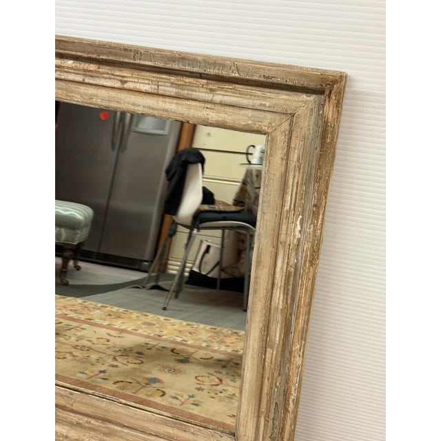 Design Plus Gallery presents a Pine Wood Wall Mirror. The rustic mirror has a distressed appearance and may be an antique...