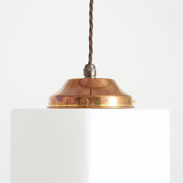 An unusual antique opaline pendant light in an art deco style . The light has a cube shaped opaline glass shades with...