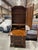 This traditional drop front secretary desk showcases a warm, rich wood finish and a timeless silhouette. The upper section...