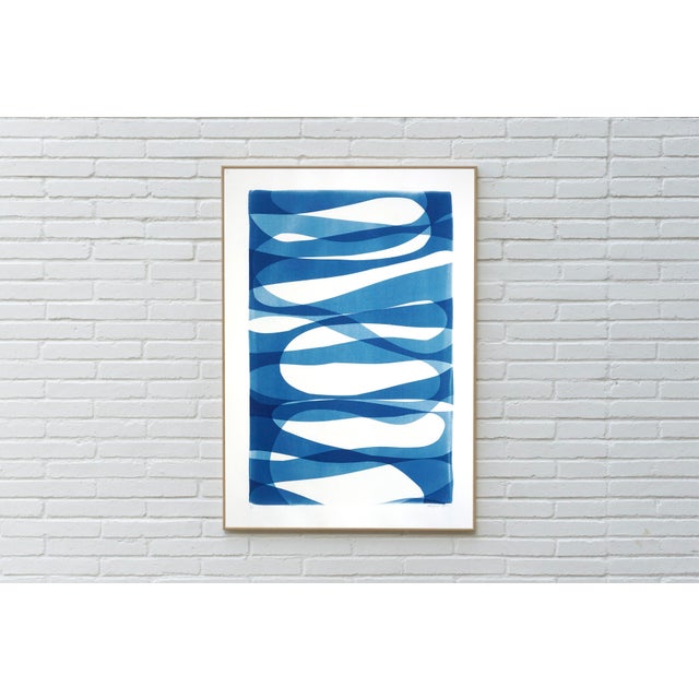 This one-of-a-kind cyanotype monotype layers soft, sinuous bands of blue to create a serene, wave-like field of motion....