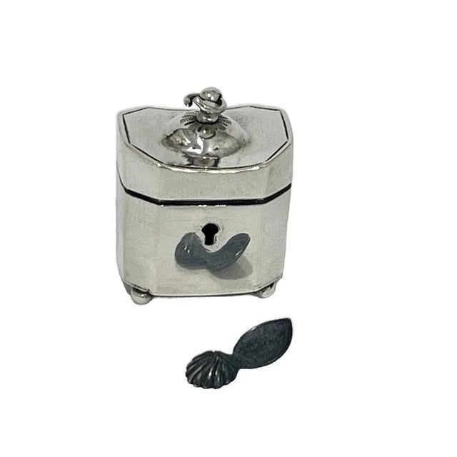 A 19th Century Dutch miniature Dollhouse silver tea caddy A Dutch silver tea caddy of 2.5 cm high in octagonal shape with...