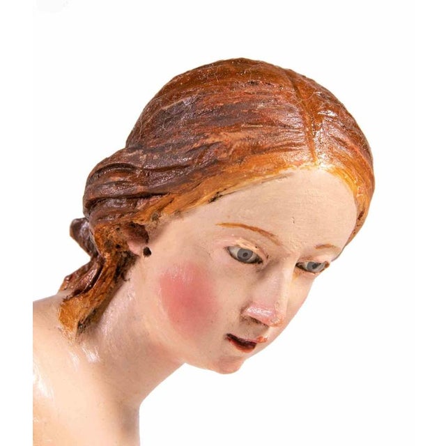 Head of young girl is a splendid sculpture realized in polychrome ceramic with glass eyes. Neaples, 18th Century. Very...