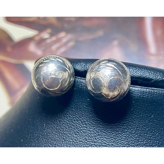 Hand Engraved hand tooled sterling silver earrings, with zigzag perimeter and angle cut design. All marked sterling...