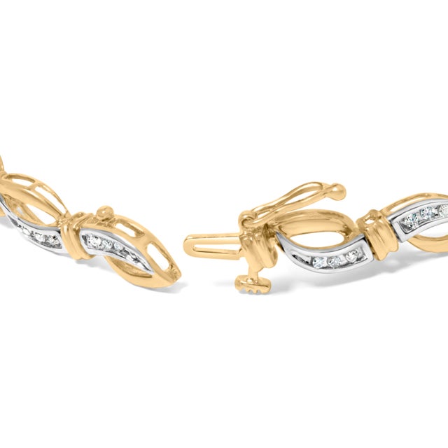 Adorn your wrist with timeless elegance and grace, courtesy of this exquisite round-cut diamond link bracelet. Crafted...