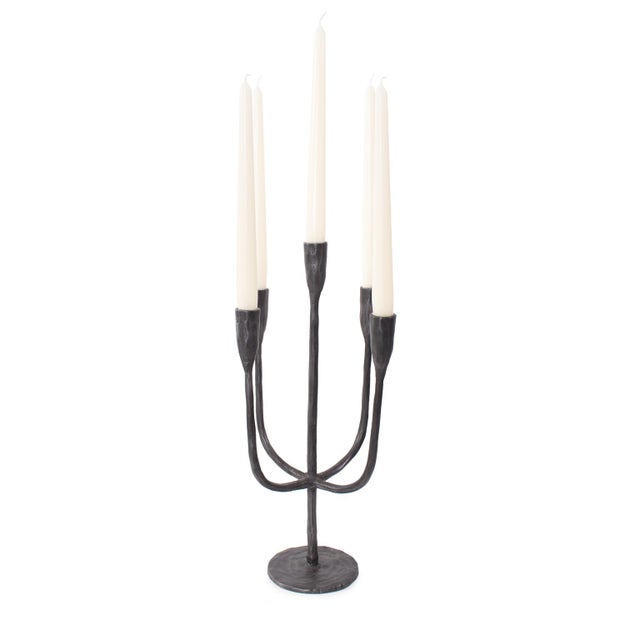 A statement piece with an industrial edge. Crafted to resemble raw graphite, this distinctive candle holder features five...