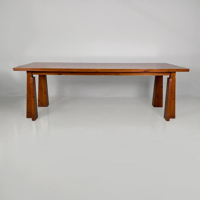Italian mid-century modern extendable wooden dining table, 1970s Extendable dining table made entirely of wood. The top is...