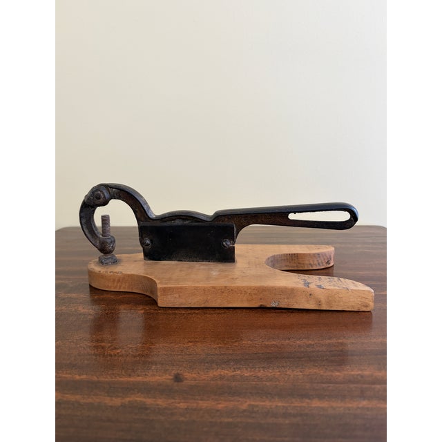 A beautiful antique French Country style hand-made wooden herb-cutting board with an iron handle and cutter. This piece...