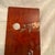 Asian wall hanging panel imade of wood with brass and silver stamped cut and placed on a dark stained mahogany with a...